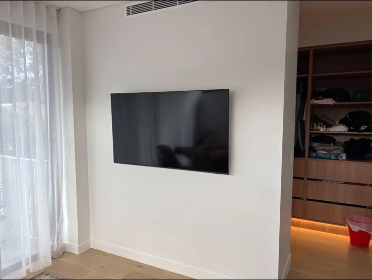 Clean wall-mounted TV installation by All Set Electrical